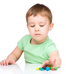 Image showing Portrait of a boy with candies