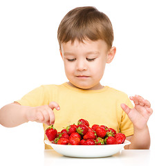 Image showing Little boy with strawberries