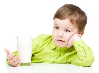 Image showing Cute little boy with a glass of milk