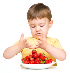 Image showing Little boy with strawberries