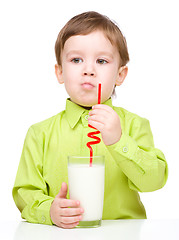 Image showing Cute little boy with a glass of milk