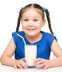 Image showing Cute little girl with a glass of milk