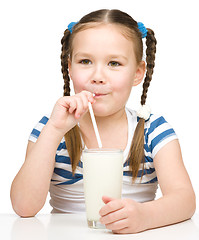 Image showing Cute little girl with a glass of milk