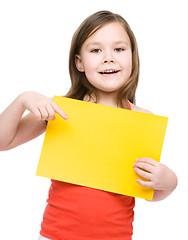 Image showing Little girl is holding blank banner