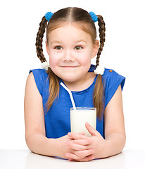 Image showing Cute little girl with a glass of milk