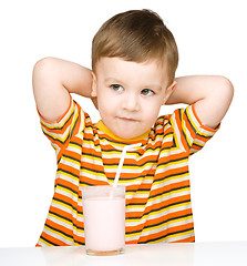 Image showing Cute little boy with a glass of milk