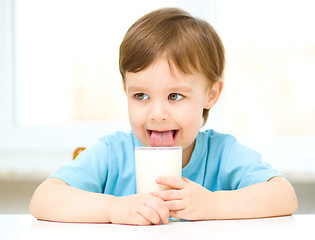 Image showing Cute little boy with a glass of milk