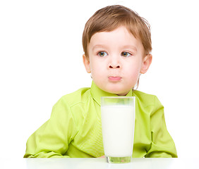 Image showing Cute little boy with a glass of milk