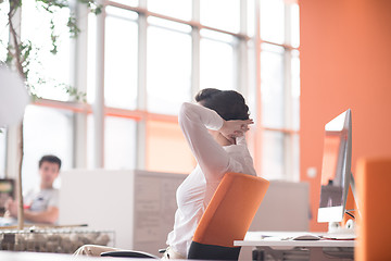 Image showing happy young business woman relaxing and geting insiration