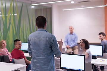 Image showing student answering a question in classroom