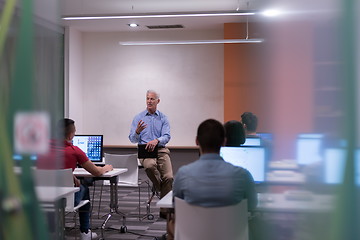 Image showing teacher and students in computer lab classroom