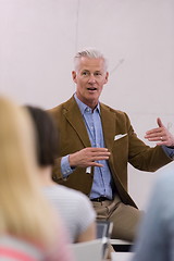 Image showing teacher with a group of students in classroom