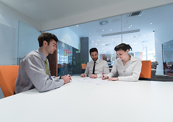 Image showing young couple signing contract documents on partners back