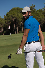Image showing golf player portrait from back