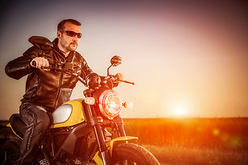 Image showing Biker on a motorcycle