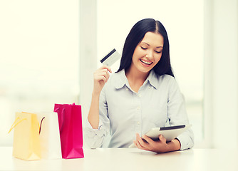 Image showing smiling woman with blank screen tablet pc