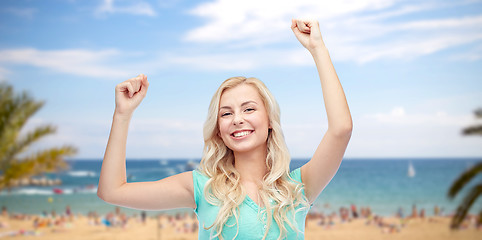 Image showing happy young woman or teen girl celebrating victory