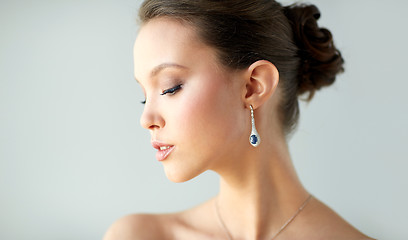 Image showing close up of beautiful woman face with earring