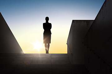 Image showing silhouette of business woman with over sun light