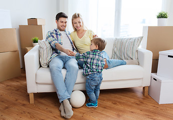 Image showing happy family moving to new home and playing ball