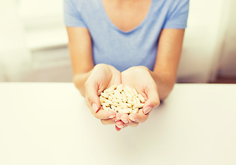 Image showing close up of woman hands with medicine or pills