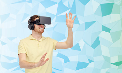 Image showing happy man in virtual reality headset or 3d glasses