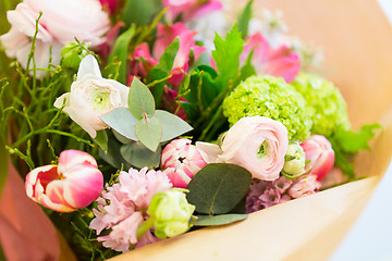 Image showing close up of bunch in paper at flower shop