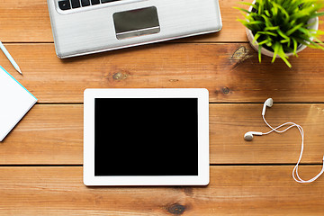 Image showing close up of tablet pc computer on wooden table