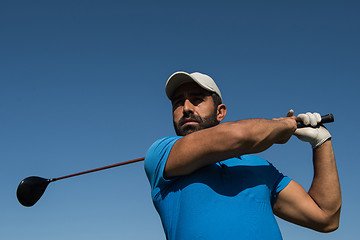 Image showing golf player hitting shot