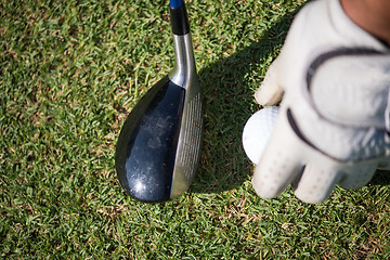 Image showing golf club and ball in grass