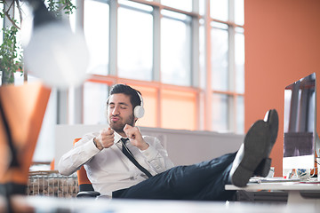 Image showing relaxed young business man at office