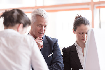 Image showing young startup businessman making presentation to senior investio