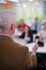 Image showing teacher with a group of students in classroom