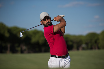 Image showing golfer hitting a sand bunker shot