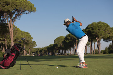 Image showing golf player hitting shot