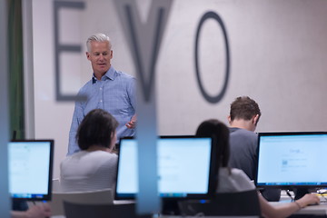 Image showing teacher and students in computer lab classroom