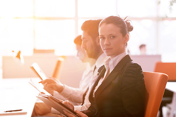 Image showing business woman at  office people group on meeting  in background