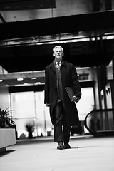 Image showing handsome senior business man walking