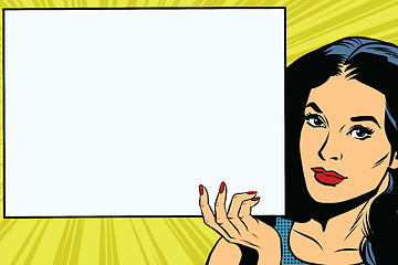 Image showing Brunette girl holding a blank rectangular poster