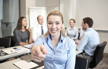 Image showing group of smiling businesspeople meeting in office