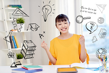 Image showing happy asian young woman student learning at home