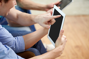 Image showing close up of happy friends with tablet pc at home