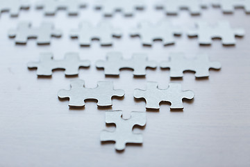 Image showing close up of puzzle pieces on table