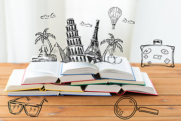 Image showing close up of books on table with landmarks doodles