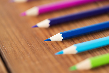 Image showing close up of crayons or color pencils on wood