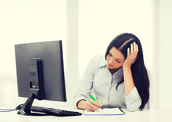 Image showing tired businesswoman or student