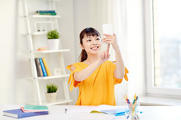 Image showing asian woman student taking selfie with smartphone