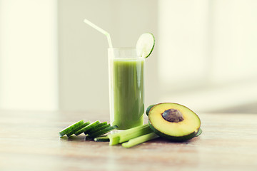 Image showing close up of fresh green juice glass and vegetables