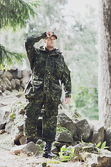 Image showing young soldier or ranger in forest