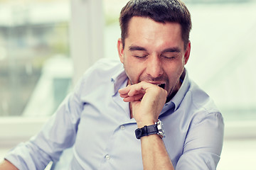 Image showing yawning tired man at home or office